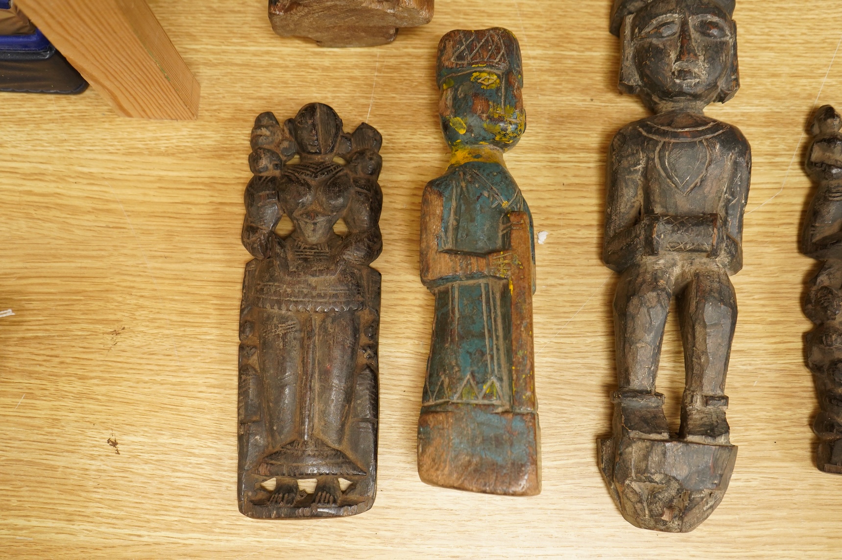 A group of Indian carved figures of deities, largest 42.5cm